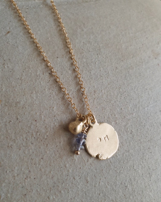 Chai gold necklace with blue stones and pomegranate charm